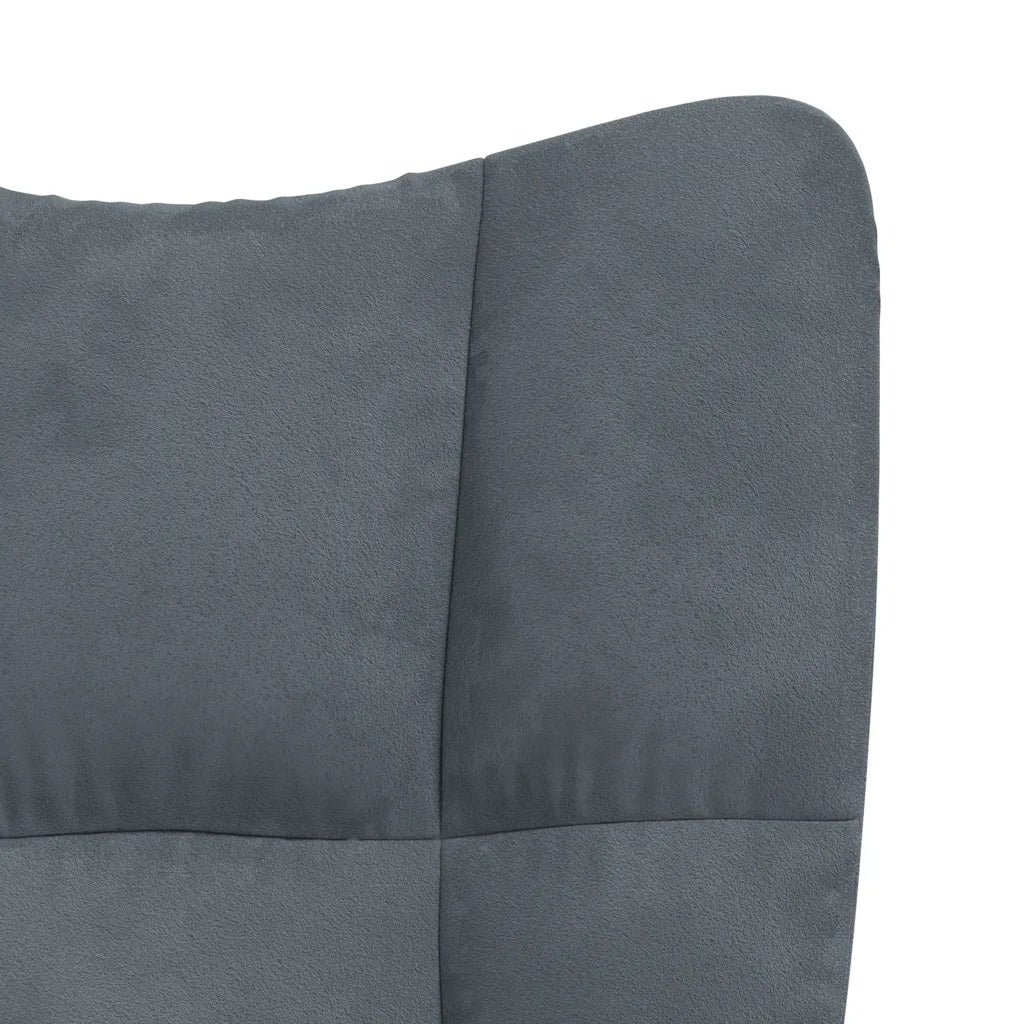 Un Fauteuil à Bascule Matelassé de couleur gris foncé.