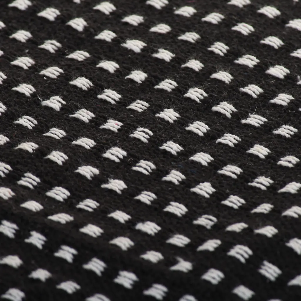 Une Couverture à Pois élégante 100% coton.