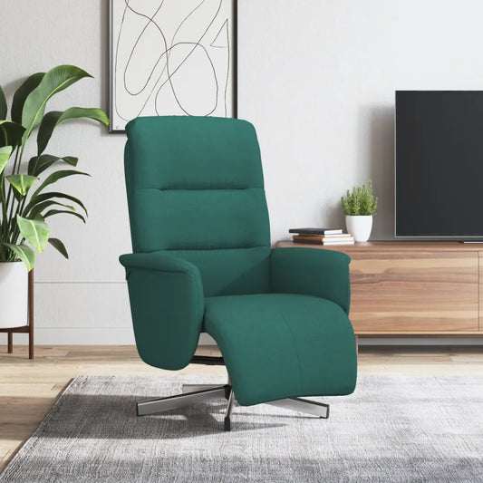 Fauteuil de repos inclinable en tissu vert dans un salon moderne.